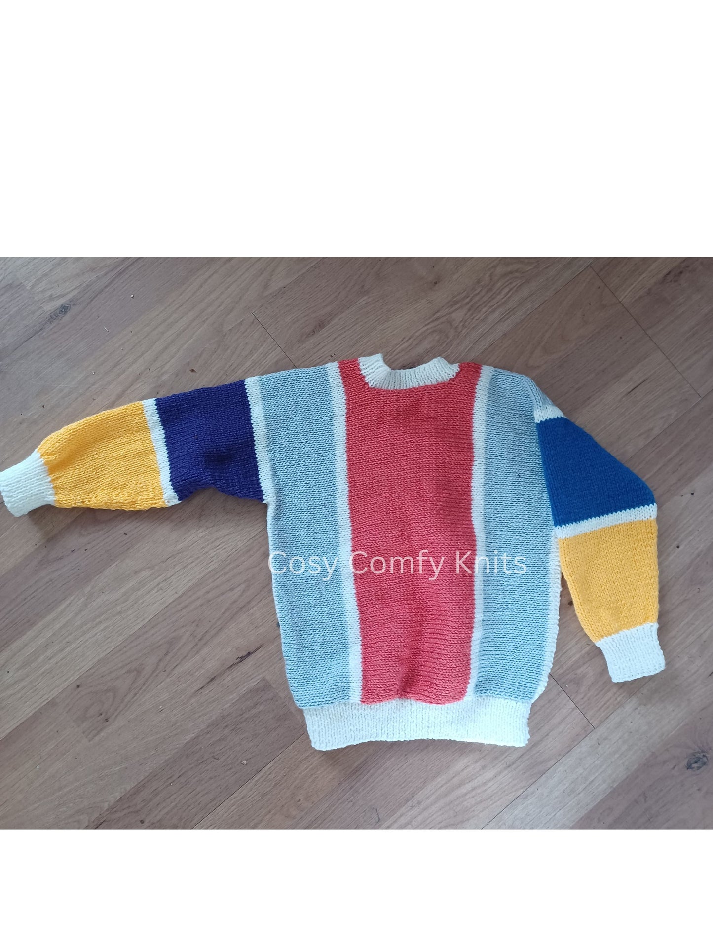 Colourful side to side hand knitted jumper in vibrant colours.