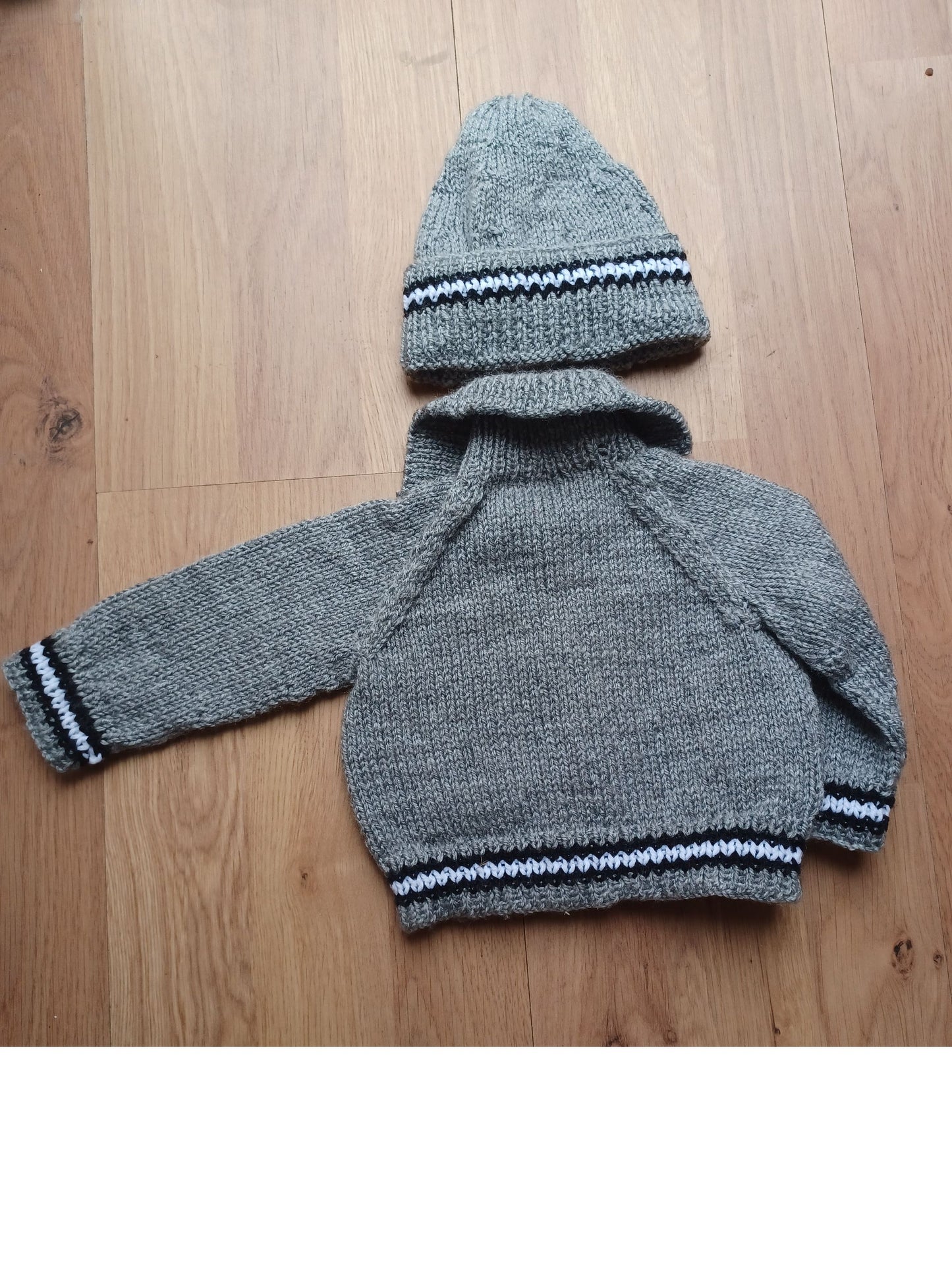 Hand Knitted Grey Cardigan with pockets, matching hat and colourful edging stripes
