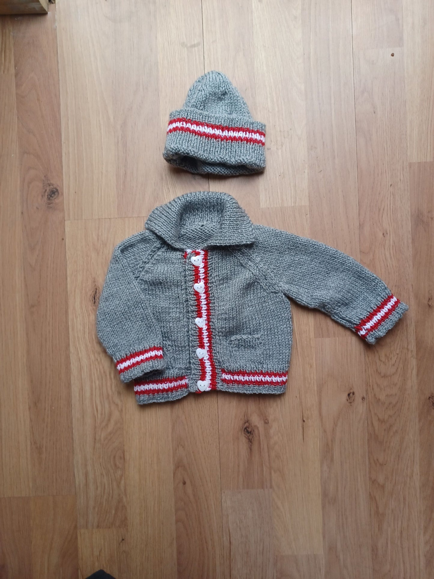 Hand Knitted Grey Cardigan with pockets, matching hat and colourful edging stripes