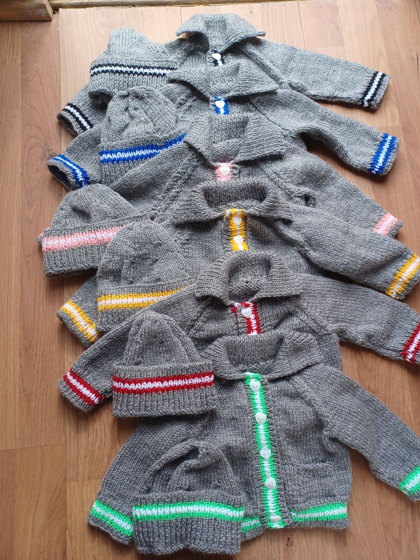 Hand Knitted Grey Cardigan with pockets, matching hat and colourful edging stripes