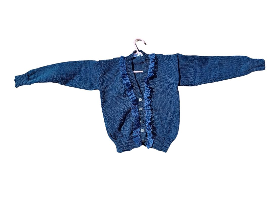 Lovely navy cardigan with a dash of lace added around the neck line, creating a distinctive look. Fabolous for home, play or school wear.