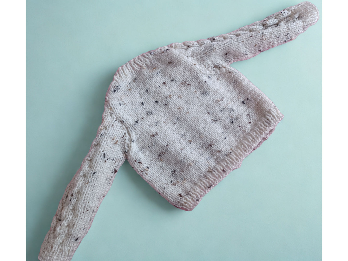 Lovely long sleeved Cardigan, in a tweed yarn with cable fronts panels and sleeves